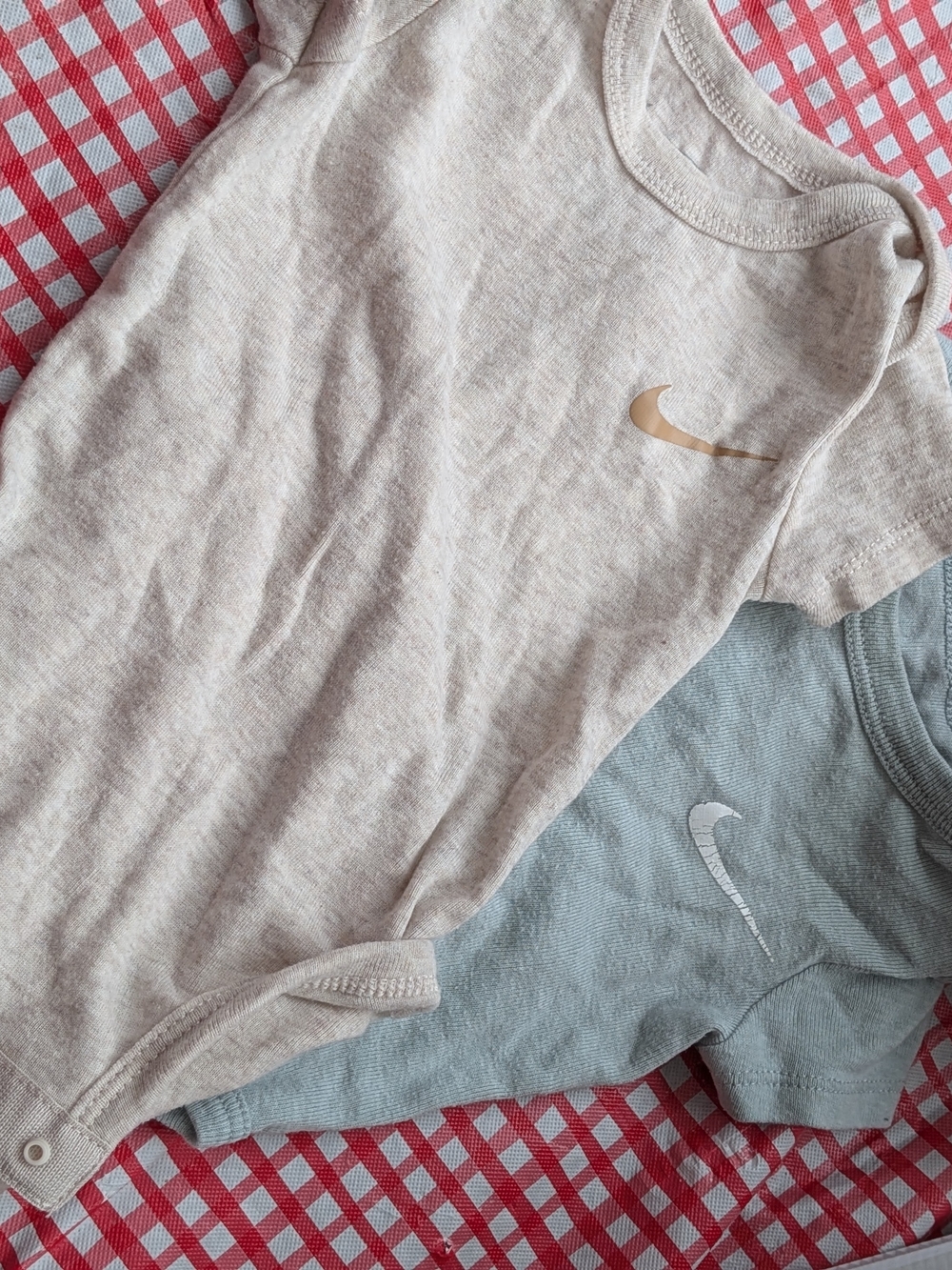 Nike Short-Sleeve Baby Onesies in Cream and Light Blue